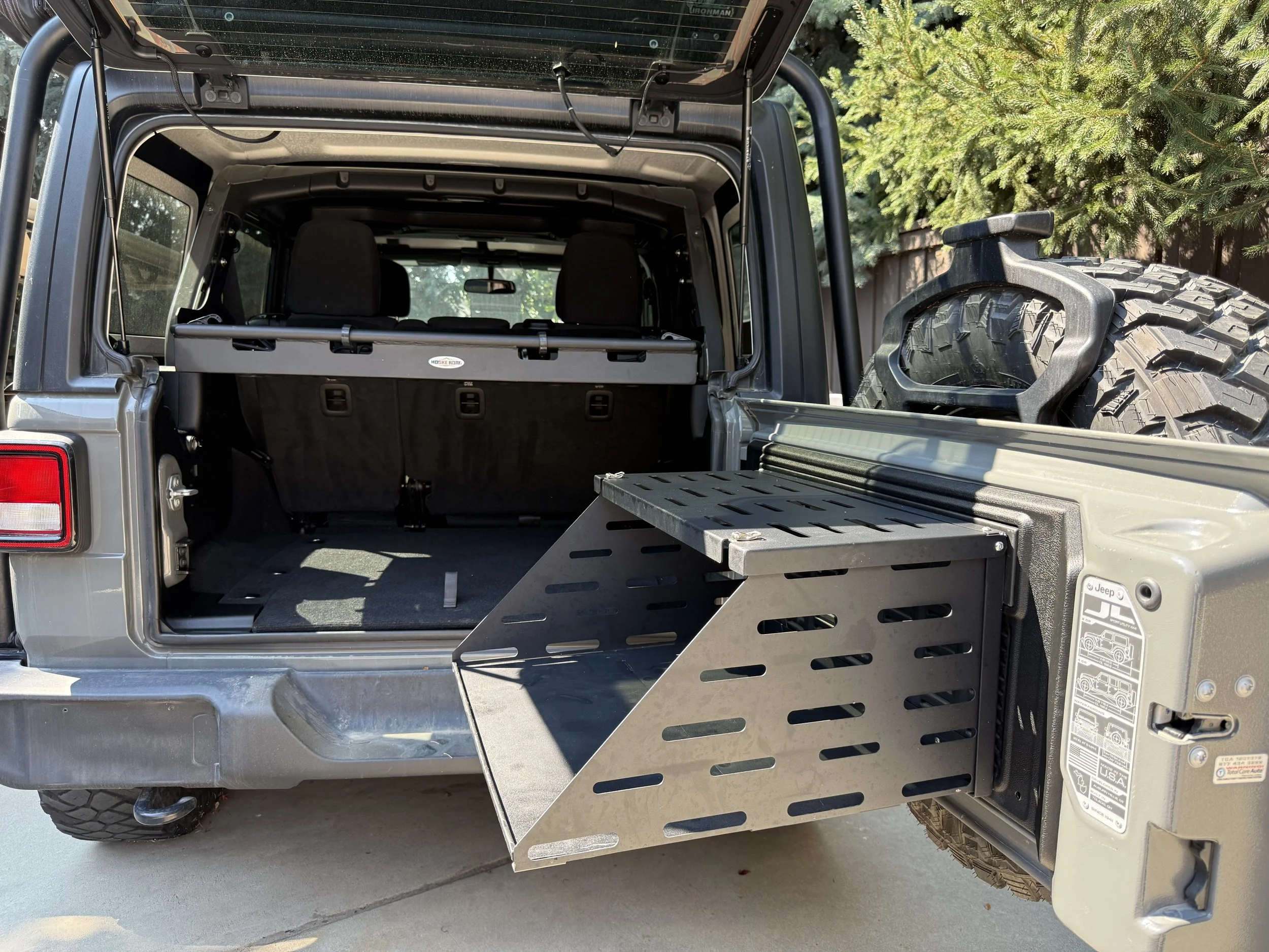 Rear cargo area with tailgate table extended and drawer storage system visible